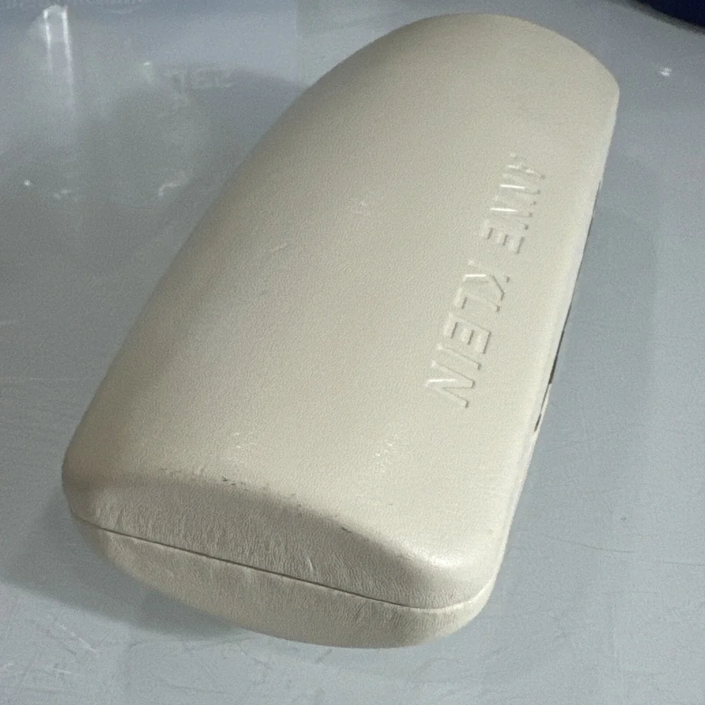 Anne Klein off white hard eyeglass clamshell case with logo